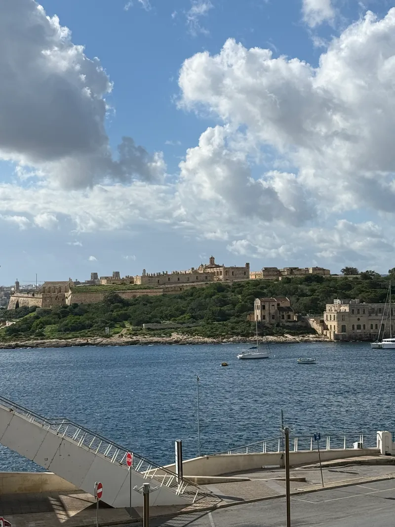 The Sliema seafront from Tigne Point, looking across Marsamxett to Fort Manoel and the yachts. Ten minutes on foot to the Valletta ferry, and this is the morning walk