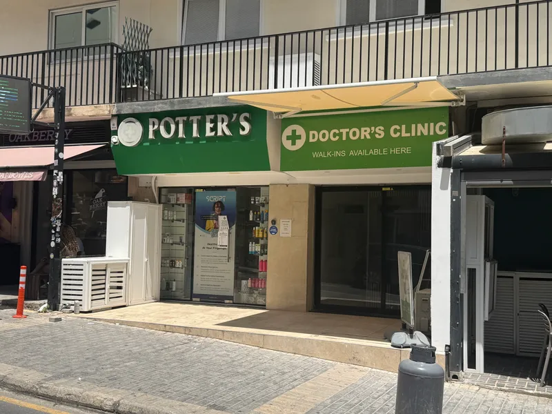 A neighbourhood pharmacy in St Julian's with a walk-in doctor's clinic next door. This pairing is everywhere, and it is how most minor problems actually get dealt with.