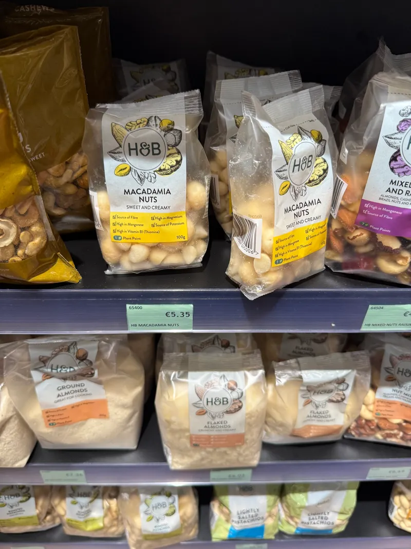 Macadamias at €5.35 a bag in a St Julian's supermarket: the imported-goods tax in a single price label. Anything not grown or made locally carries the shipping