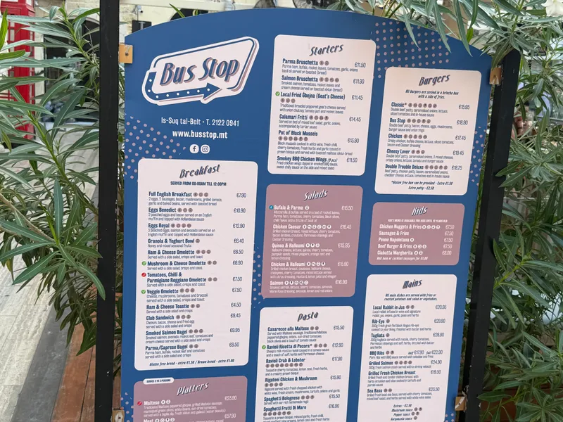 A menu board outside the Valletta food market. Prices on every line, which is the only honest way to judge what eating out costs.