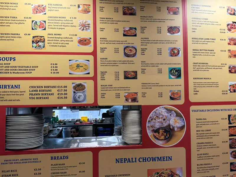 The food hall menu a few streets away: biryani around €15, naan €3.30, rice €3.50. This is the mid-range, not the tourist strip.